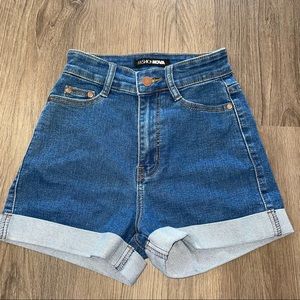 medium wash “booty lifting” jean shorts